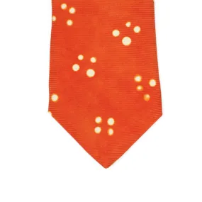 Orange self-tipped silk tie, white Adire cross dot pattern